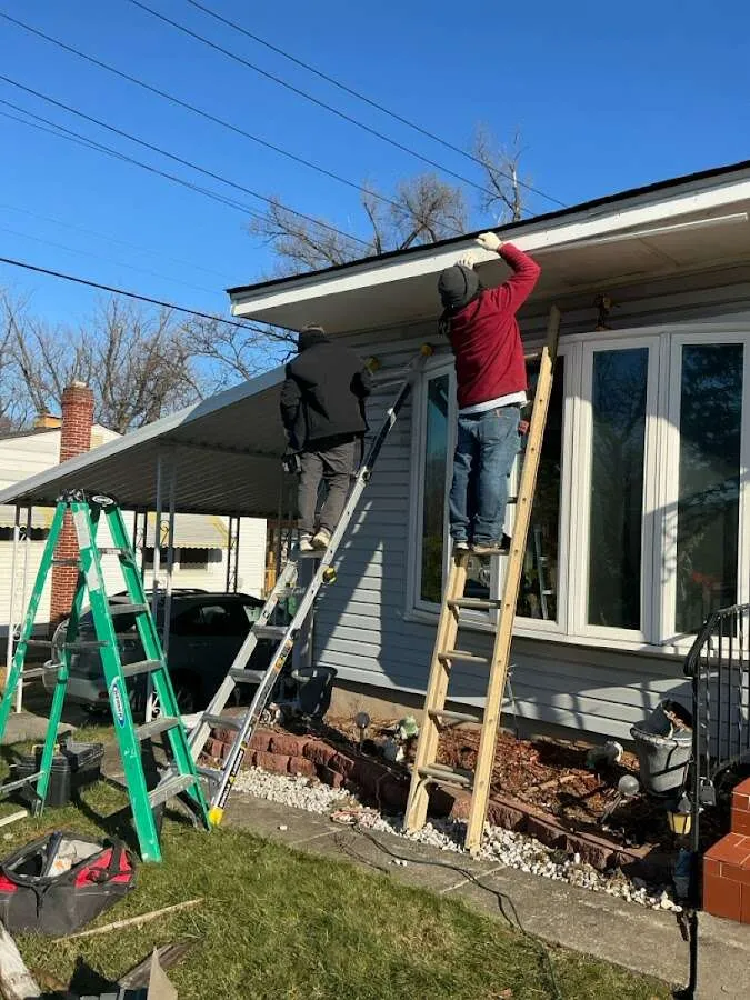 Restoration crew performing exterior repair in St. Clair Shores